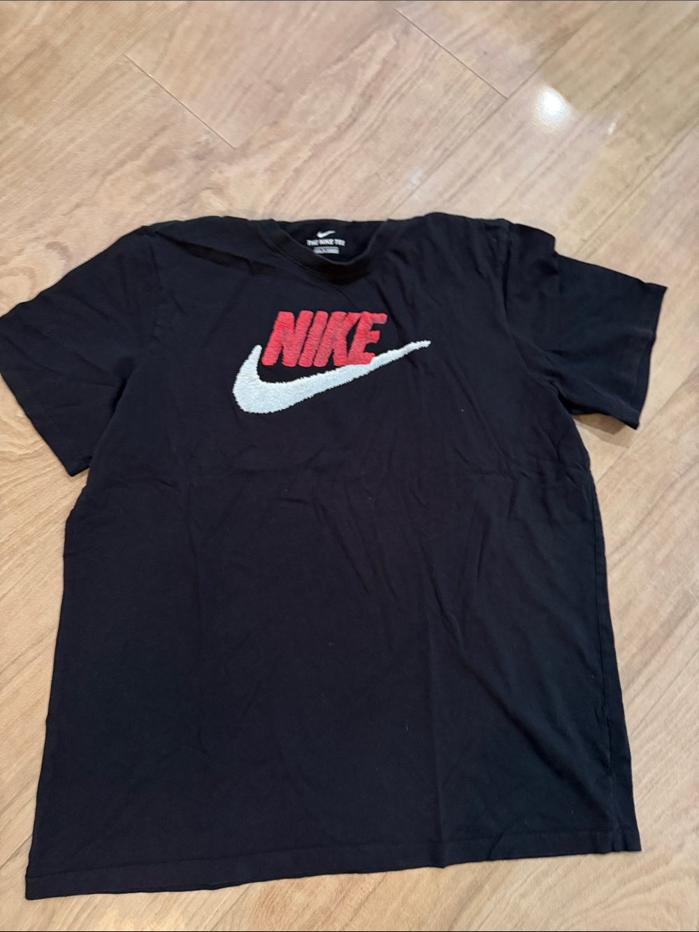Nike Black Short Sleeve T-Shirt with Red Logo and White Swoosh